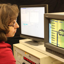 NIST researcher Dawn Cross calibrating a mercury thermometer