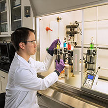 researcher Edwin Chan is using an instrument called the MDUSA (Multi Deposition Unassisted Spin Assembly) to create model filtration membrane materials