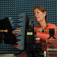 NIST engineer Katherine MacReynolds prepares a new NIST "tabletop" range for characterizing high-performance antennas