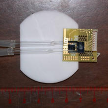 Prototype microchip device combining NIST's miniature atomic magnetometer with a fluid channel 