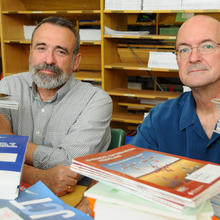 Frenkel and Chirico in front of a stack of books