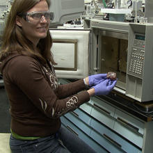 Tara Lovestead prepares a sample of meat for testing