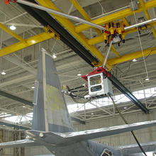 A worker in a protective cab on a NIST-developed revolutionary robotic platform