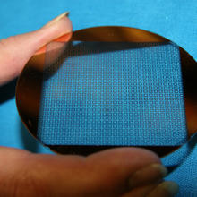 metafilms of both yttrium iron spheres embedded in a matrix, and tiny copper squares etched on a wafer.