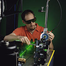 Electrical engineer Richard Mirin aligns a laser