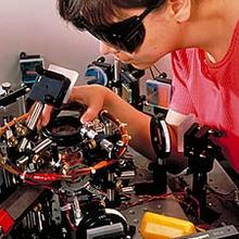 NIST physicist Deborah Jin aligns an infrared laser for a magneto optical trap as part of a project to create "superatoms."