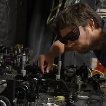 NIST physicist Krister Shalm with the photon source used in the Bell test