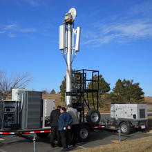 Photo of NIST scientists with the PSCR Deployable LTE Cell-on-Wheels