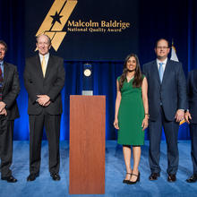 Photo of representatives from 2016 Baldrige winner Memorial Hermann with DOC and Baldrige representatives