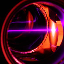 A purple laser beam slows erbium atoms