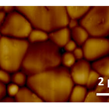 ferroelastic domains (striations) within each crystal