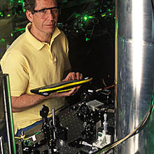 NIST physicist Jim Bergquist with the mercury ion clock