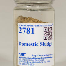 photo of a bottle of brown powder labeled NIST SRM 2781.