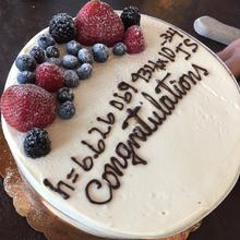 cake with winning guess of Planck's constant value written on it