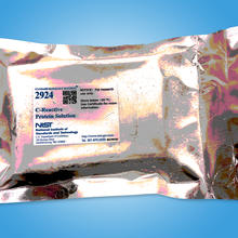Gold shiny rectangular package with Standard Reference Material 2924 C-Reactive Protein Solution label