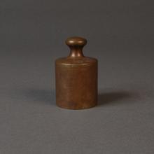 Grave, a brass mass standard