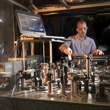 Researcher John Bender setting up a laser table in a laboratory