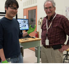 Two men standing in lab