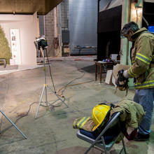 NIST Employee putting on his fire gear