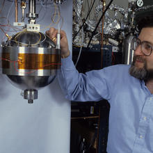 NIST researcher Mike Moldover with a basketball-sized metal sphere used to measure the speed of sound in a gas