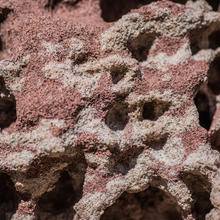 Asteroid-like landscape formed of red and gray sandstone from Marquette, Michigan
