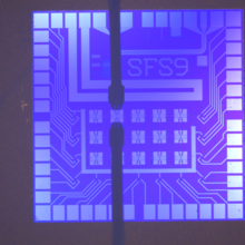 Purple square chip with Xs and the code SFS9 on it.