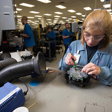 A woman working at Itron