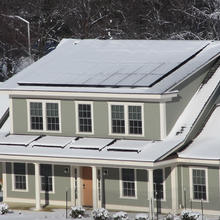 photo of the house in snow