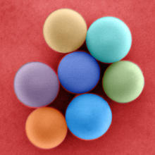 Colorized illustration of nanometer-scale glass beads with slightly different diameters.