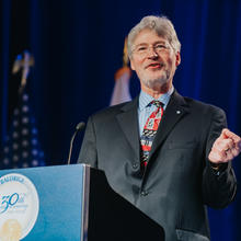 Walt Copan at a podium