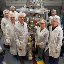 Group of scientists in clean room gear