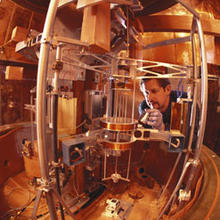 Physicist Richard Steiner adjusts the electronic kilogram, an experimental apparatus for defining mass in terms of the basic properties of nature.