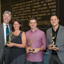 NIST Director along with three staff members holding an Emmy Award