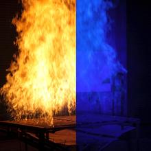 In this photo, we see a split-screen image of a laboratory fire. The left side shows the fire obscuring the view of an object behind it while the right side shows the same object with the clarity dramatically enhanced using ordinary blue light.