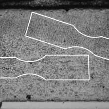 Cross section of a SAC solder joint in a BGA [2], with sketches of micro specimens that could potentially be extracted and individually tested to measure spatially varying properties.