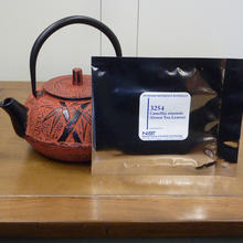 tea pot with SRM packet in front of it