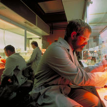 three people at lab benches