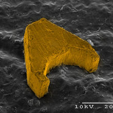Photomicrograph shows Mag-µBot, the entry from Carnegie-Mellon University in the NIST Mobile Microrobotics Challenge.
