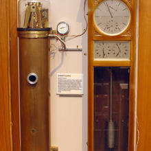 A Shortt Electro-Mechanical Clock in a case