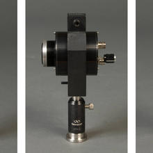 three pictures of a device that looks like an old camera