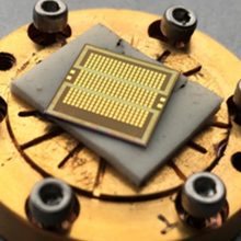 Fig. 1. Colorized scanning electron micrograph of a crossbar array with 30 nm diameter magnetic tunnel junctions, a schematic drawing of the crossbar, and a schematic drawing of a magnetic tunnel junction.
