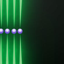 Row of five purple spheres, each held top and bottom by tips of long green probes, on black background.