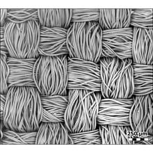Bundles of polyester fibers in a crisscross pattern