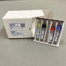 A white box is open with a special tray holding vials with different-colored caps.