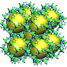 Crystal structure is shown as an open cube with nine empty spaces marked by spheres.