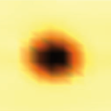 A blurry dark circle lightens at the edges on a yellow background.