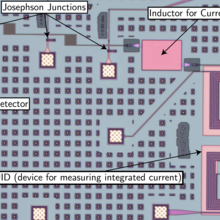 Photo of an electronic circuit with various components appearing as larger and smaller squares.