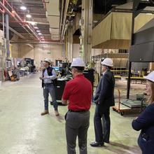 Individuals in hard hats in a laboratory