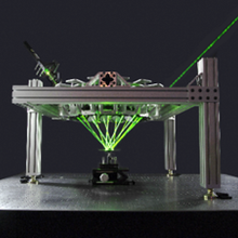 High Amplification Laser-pressure Optic (HALO)