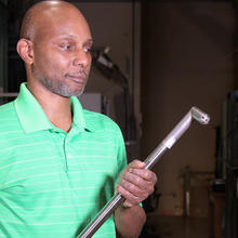 NIST’s Aaron Johnson holding the new NIST pitot tube